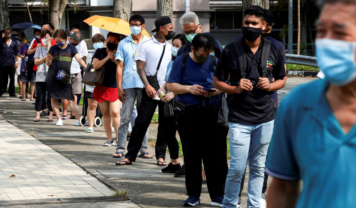 People queue to take their antigen rapid tests in Singapore